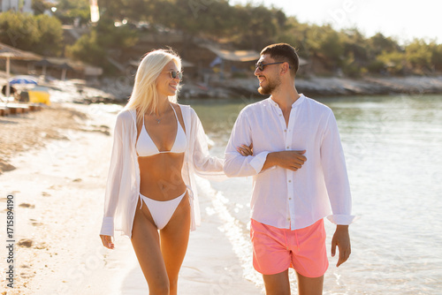Couple enjoys a sunny beach...