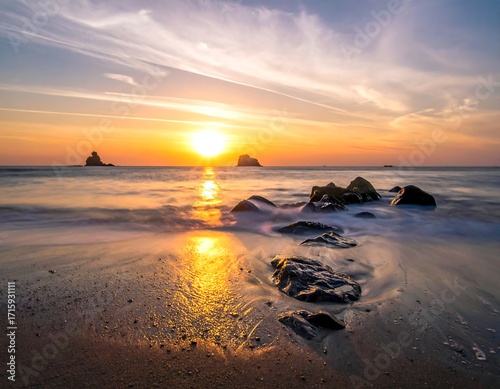 Sunrise over a tranquil beach (1)