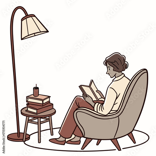 A woman relaxes in a comfortable chair reading a book next to a lamp and stack of books