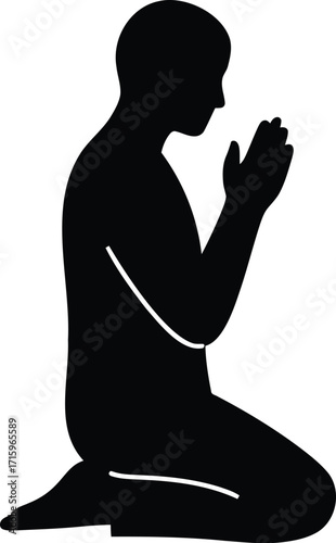 Silhouette of Person Kneeling in Prayer