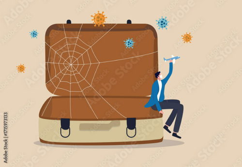 Trip cancelled, travel suspend all airports closed in Coronavirus COVID-19 outbreak crisis concept, sad man tourist sitting on empty travel bag, luggage holding toy airplane wait for travel the world