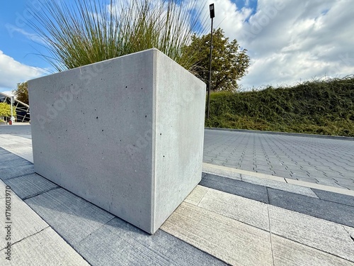 Modern concrete planter with clean lines and minimal design. Contemporary outdoor decoration for gardens, terraces, or patios.