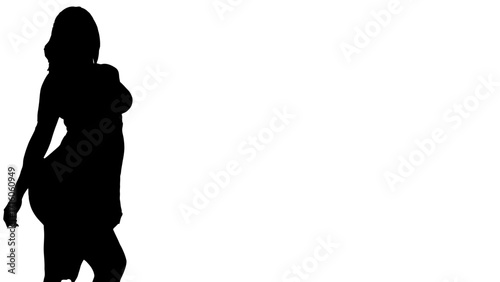 Elegant silhouette of a woman in a flowing dress, captured in a moment of grace and poise, perfect for fashion and lifestyle projects seeking timeless beauty and sophisticated style.