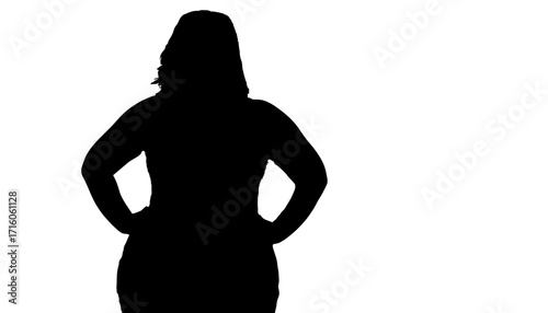 Confident woman with hands on hips embodies strength and empowerment, ready to tackle challenges with decisive action and bold presence.
