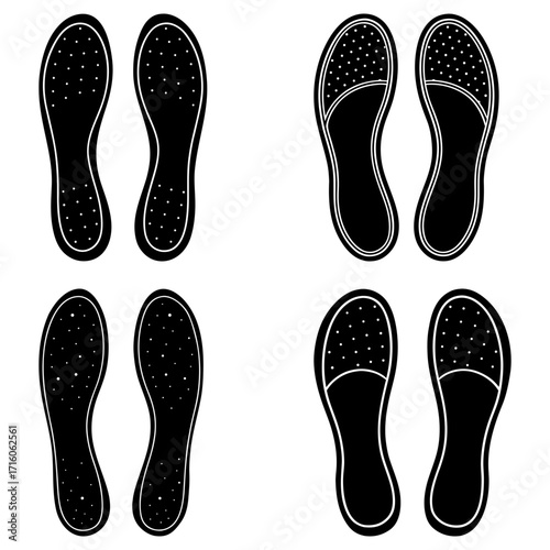 Four pairs of black insoles with varying designs arranged symmetrically on a white background surface