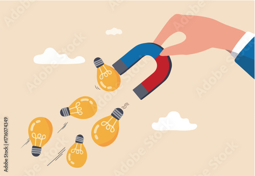 Imagination to create new ideas, creativity or innovation for new business concept, businessman hand holding magnet to magnetize or draw lightbulb lamp ideas. 