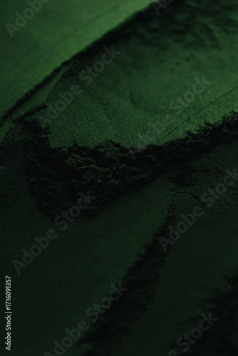 Spirulina powder close up, green superfood, organic healthy supplement