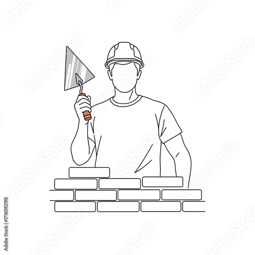 Man bricklayer holding a metal trowel in front of a wall of bricks