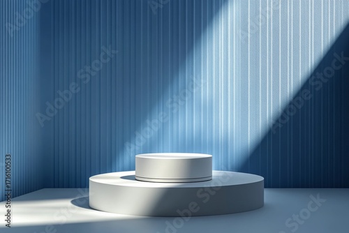 Minimalist display stage with tiered white pedestals and abstract light shadows on a textured blue wall