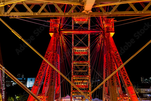 Photography Vibrant Red Illuminated Ferris Wheel at Night in Vienna with Urban Skyline