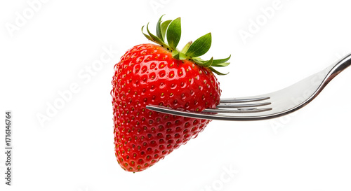 fresh red strawberry on fork isolated white background
