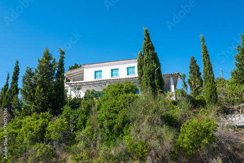 Typical Greek house with blue shutters on Paxos Greece