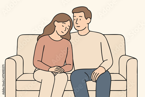 Couple sitting on sofa