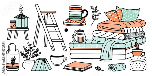 Cozy home decor elements featuring lanterns ladder stacked blankets and mugs