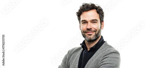 Confident Middle-Aged Man with Beard in Casual Attire Smiling Against White Background
