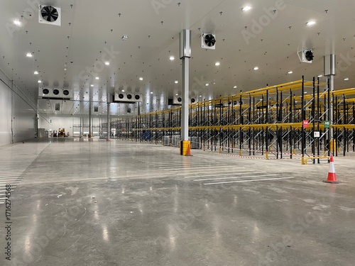 Photos brand new chiller in large warehouse facility with polished concrete floor