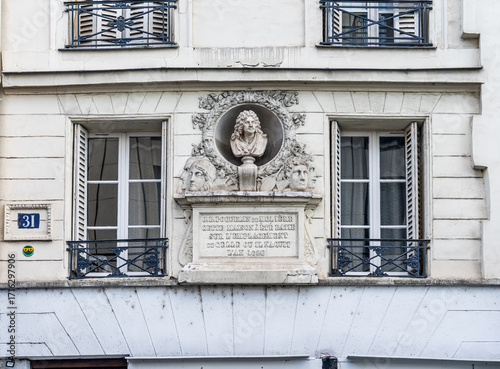 Commemorative plaque with sculpted bust on the fake birthplace of playwright Moliere at Rue de Pont Neuf 31 in Les Halles, 1st arrondissement, Paris, France