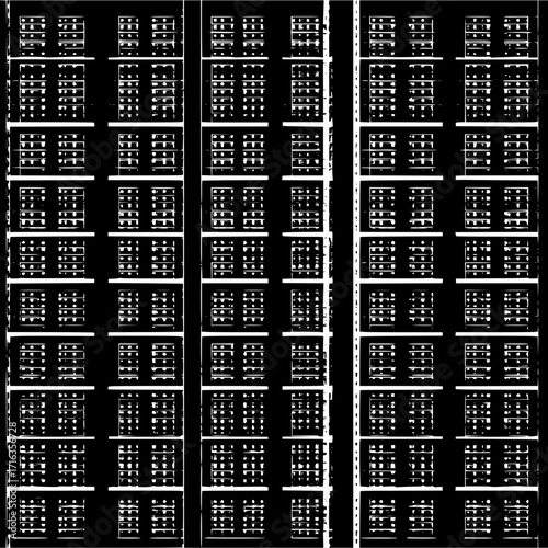 Detailed view of a building facade with multiple rows of windows and a black and white color scheme design
