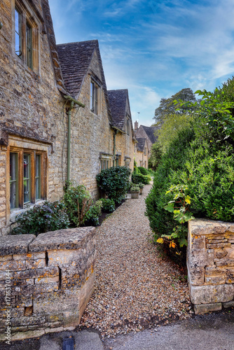 The historic and picturesque village of Bibury, in the Cotswolds, Gloucestershire, England, famous for its medieval stone houses