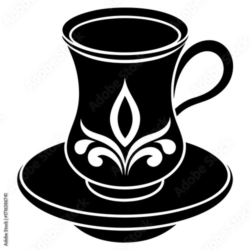 Black Turkish tea glass with ornate pattern on saucer