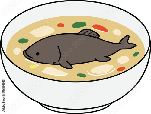 A bowl of creamy soup with a whole fish floating inside, colorful vegetables.
