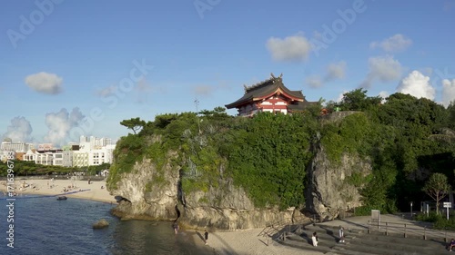 View of Naminoue beach and Naminoue Shrine - 4K view of Naha, Okinawa, Japan, clear blue sky and clouds. In daytime. Summer holiday, vacation and resort concept shot