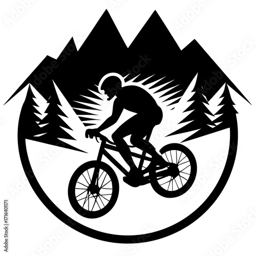 Black silhouette of mountain biker on bike with mountains and trees