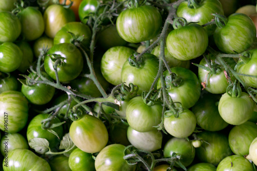 A box of green tomatoes for canning. New harvest.