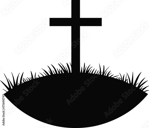 Silhouette of a cross on a grassy mound