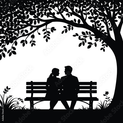 Couple silhouetted under a tree on a bench