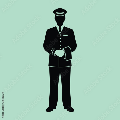 Silhouette of a uniformed pilot standing upright holding a hat with both hands on a solid background