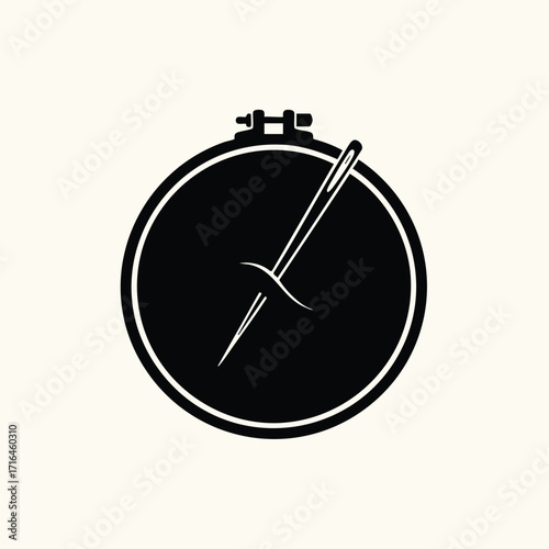 Black and white minimalist icon of an embroidery hoop with a needle and thread in a simple flat design