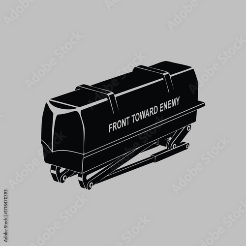 Black silhouette of a military weapon sight device with mounting brackets and directional text on a gray background