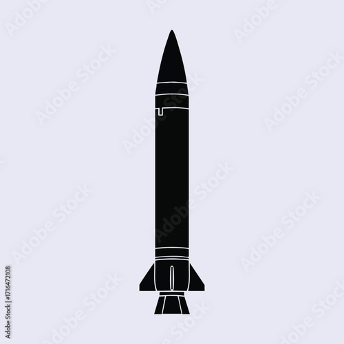 Black silhouette of a vertically standing missile rocket isolated on a plain light background with simple design