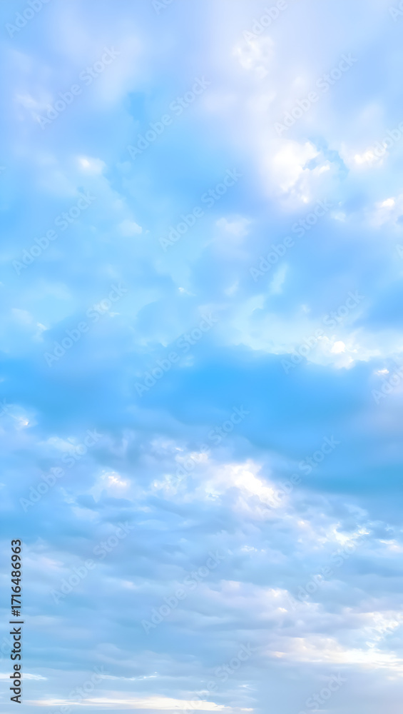Fototapeta premium Soft blue sky with wispy clouds and sunlight gentle sky scene