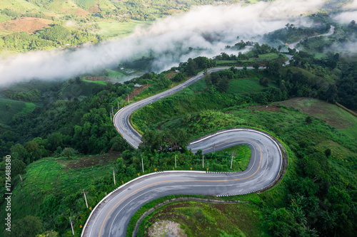 Aerial view of rice terraces and village in Loei province, Thailand.