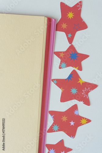 blank paper and birthday or holiday stars with space