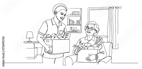 Volunteer Giving a Box of Fresh Groceries to a Senior Woman