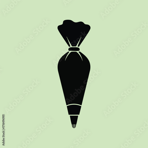 Black silhouette of a piping bag with a nozzle used for cake decorating and pastry art on a light green background