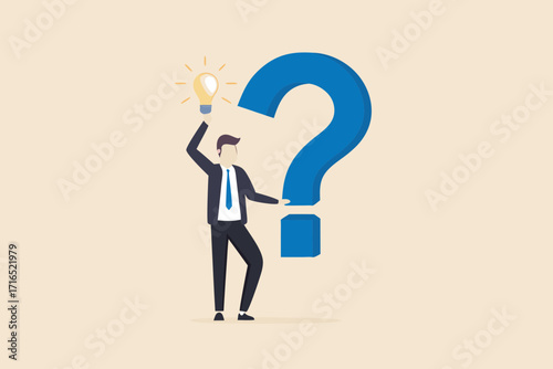 Businessman holding a glowing light bulb near a giant blue question mark representing a solution or idea