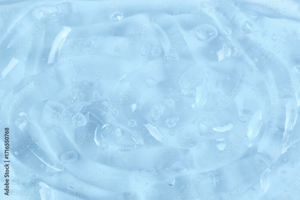 Naklejka premium Moisturizing serum or essence: surface of thick gel with bubbles.