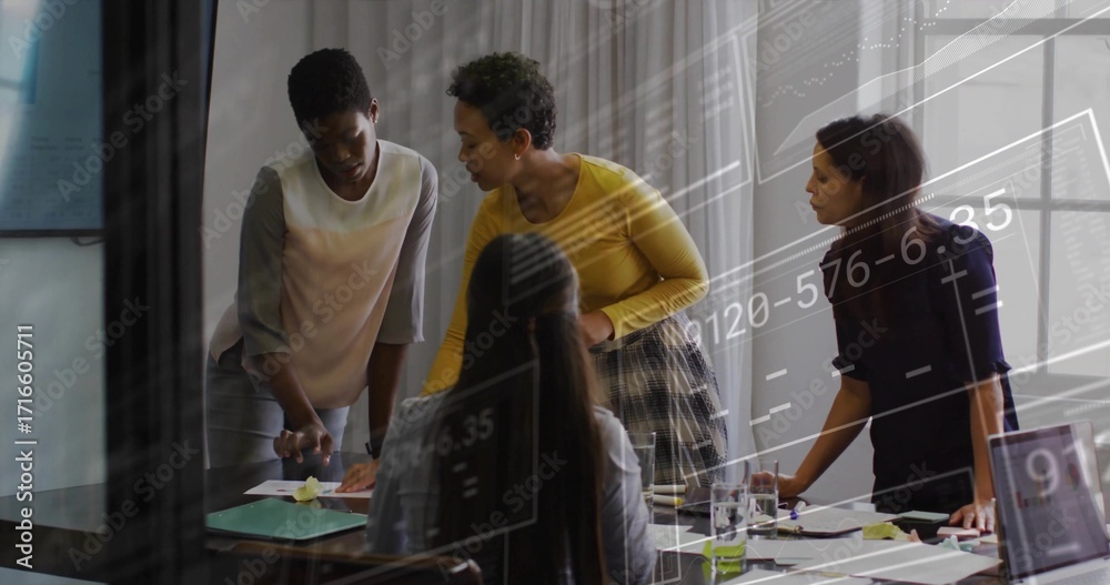 Fototapeta premium Collaborating four business women analyzing financial charts in office meeting room, with documents