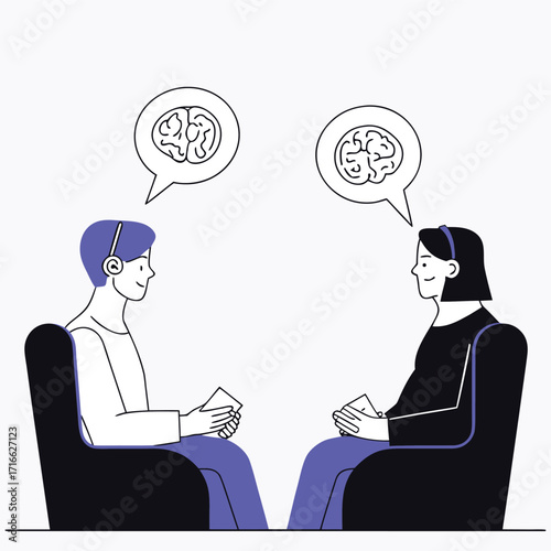 Two young adults sit opposite each other in armchairs holding papers engaged in a thoughtful convers