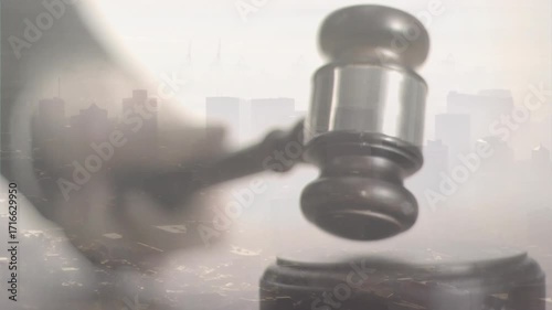 Close-up hand gripping gavel raising then striking block hovering then fading symbolizing verdict