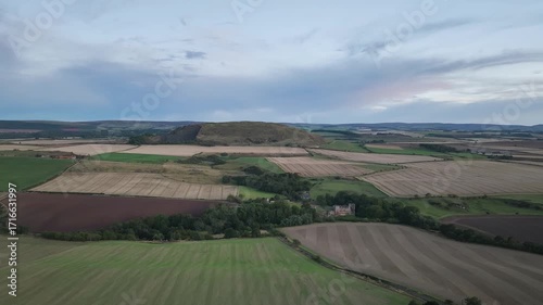 Fields and Farms over Traprain Law and Hailes Castle from a drone, River Tyne, Haddington, East Lothian, Scotland