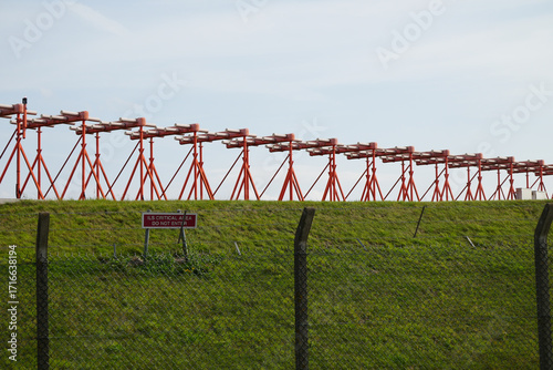 Instrument Landing System ILS Critical Area sign and antenna array at East Midlands Airport Trail Nottinghamshire England travel photo
