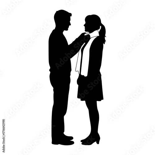 Man adjusting woman's scarf silhouette couple