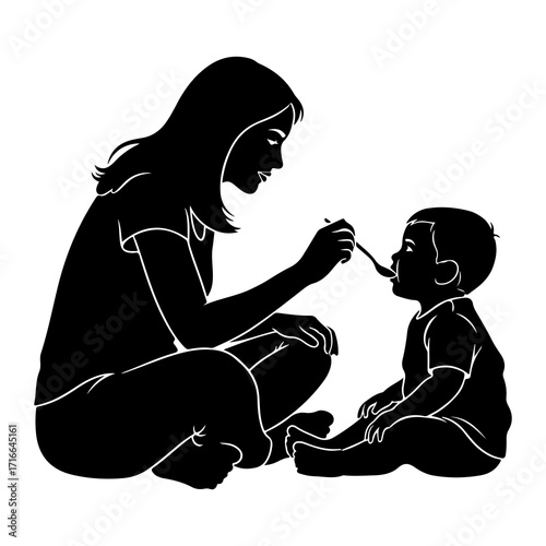 Mother feeding baby with spoon child