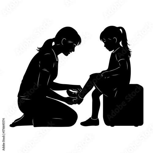 Mother helps child put on shoe helping putting on