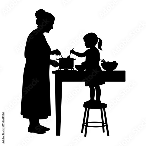 Woman and child cooking together silhouette kitchen